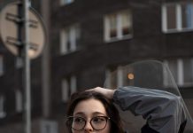 Quiet Details, Strong Impact: How to Make Simple Outfits Look More Elevated A woman sitting on the back of a motorcycle