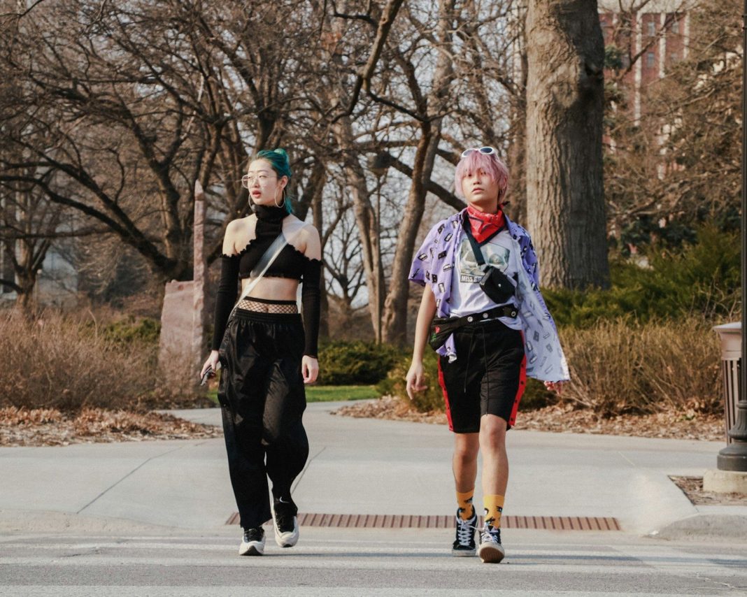 two people walking in the street