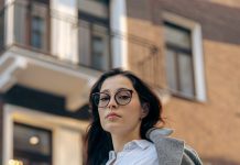 Quiet Confidence: How to Build a Refined and Modern Wardrobe A confident woman poses in the city.