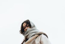 Fresh by the Season: Outfit Ideas That Feel Stylish, Easy, and Wearable Woman in trench coat and scarf on stairs