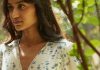 Effortless After-Dark Style: Party Outfits That Look Chic Without Trying Too Hard Woman in floral wrap dress among green leaves