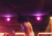 After-Dark Essentials: The Going-Out Pieces Every Stylish Wardrobe Needs a person holding a cell phone