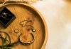 Small Details, Strong Style: How to Choose Accessories for Minimal Outfits silver rings on brown wooden round tray